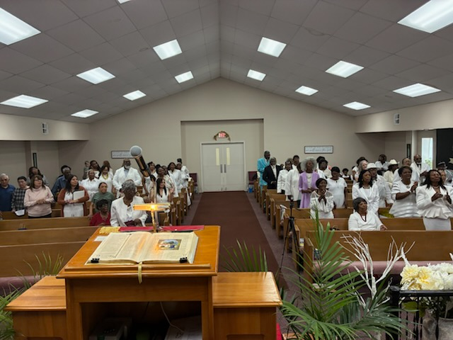 The New Light Baptist Church congregation gathered for Sunday worship in the sanctuary